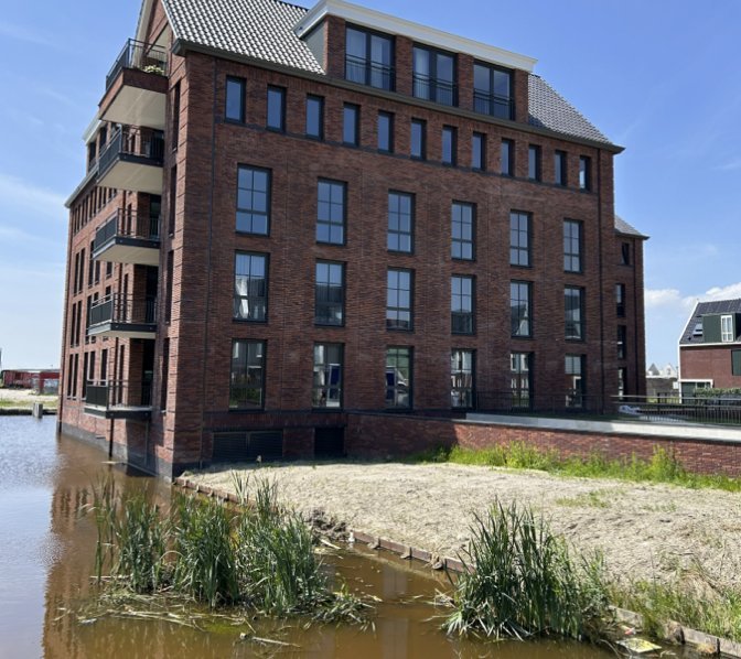 Appartementencomplex bij water met 19 units, gemeten volgens NEN 2580